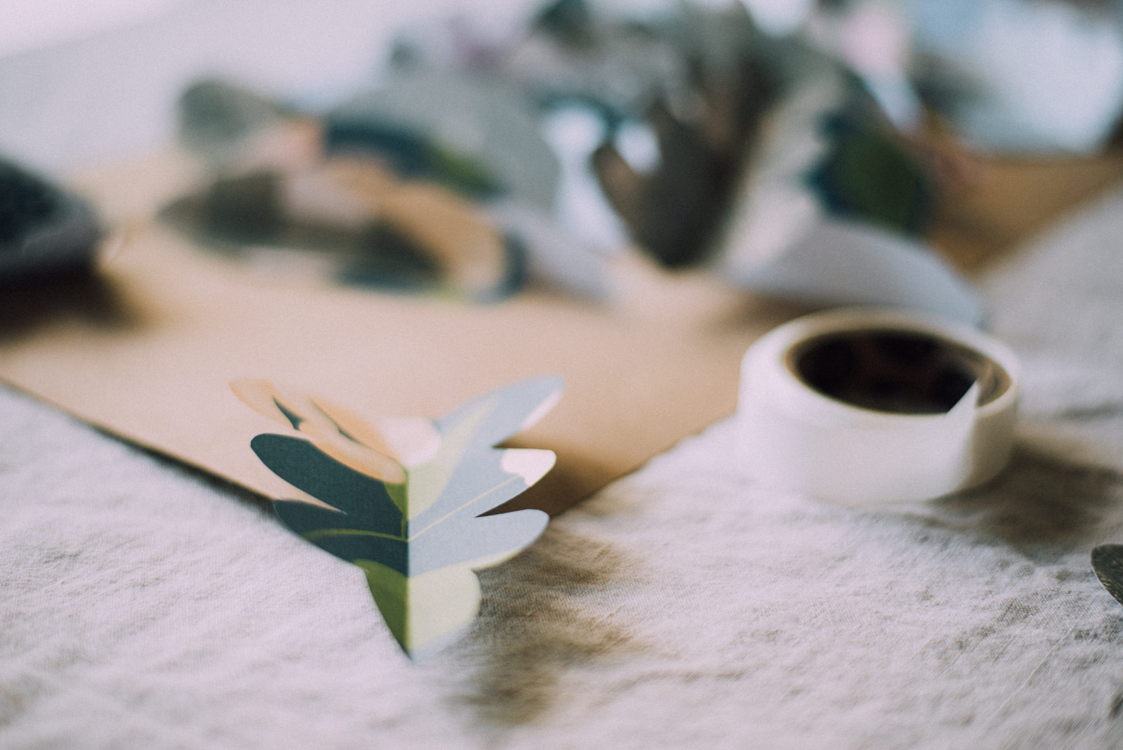 colorful craft paper cut into leaves for table runner