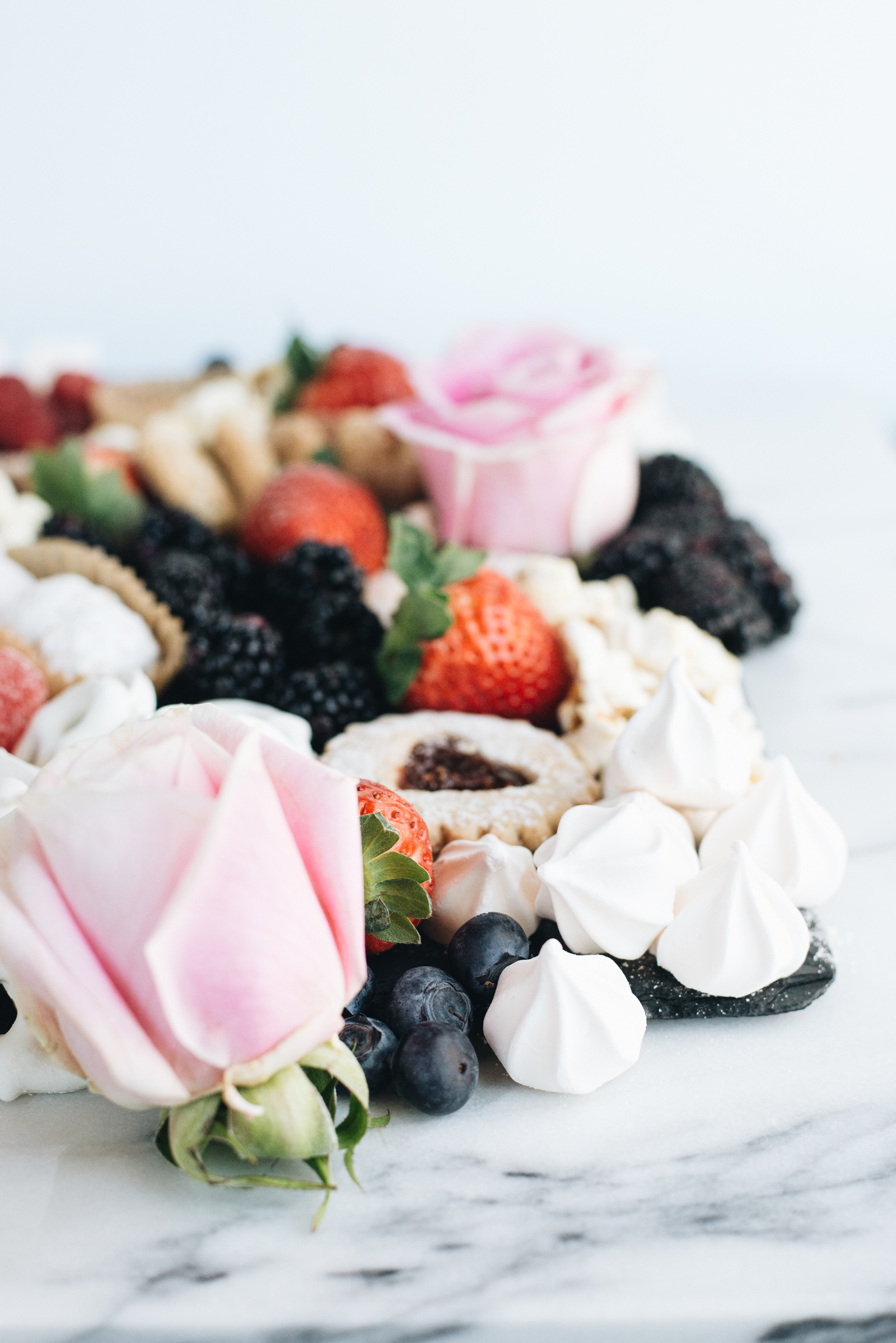 fresh roses on marble valentine's day dessert board casey wiegand