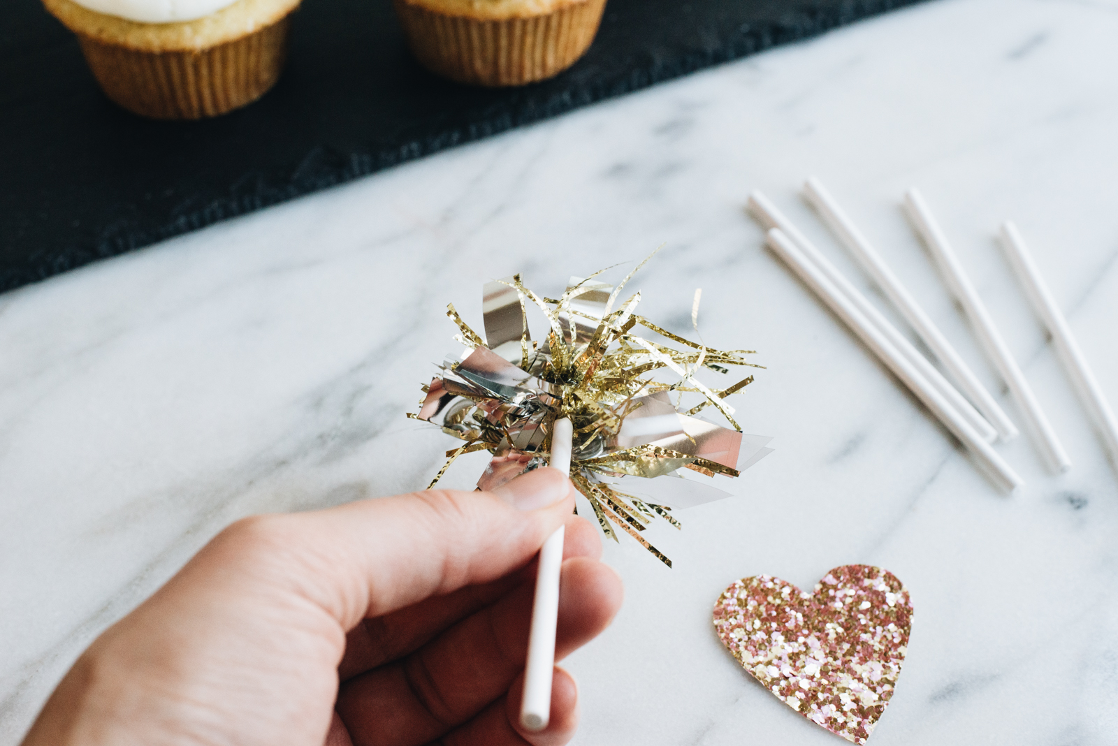 sparkly cupcake topper pom poms cut to size on lollipop sticks