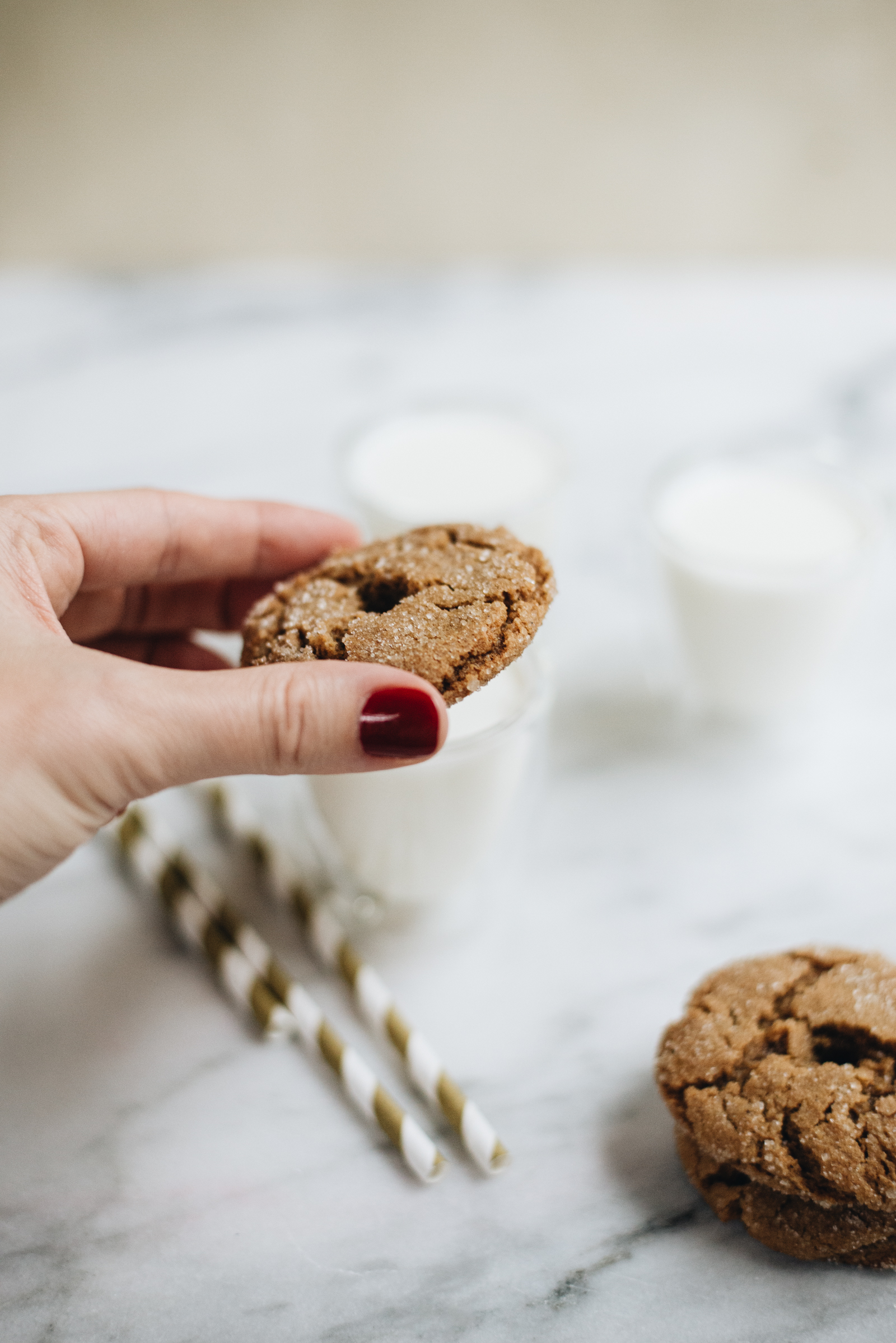 add the gingersnap cookies to the top of espresso cups filled with milk