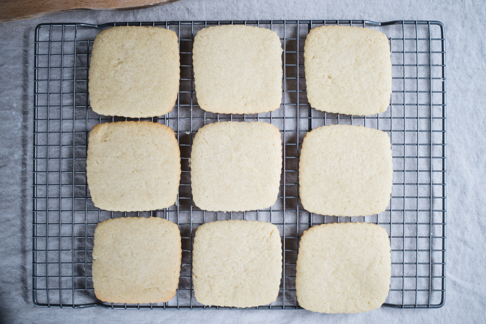 cut sugar cookie cooling on wire rack casey wiegand