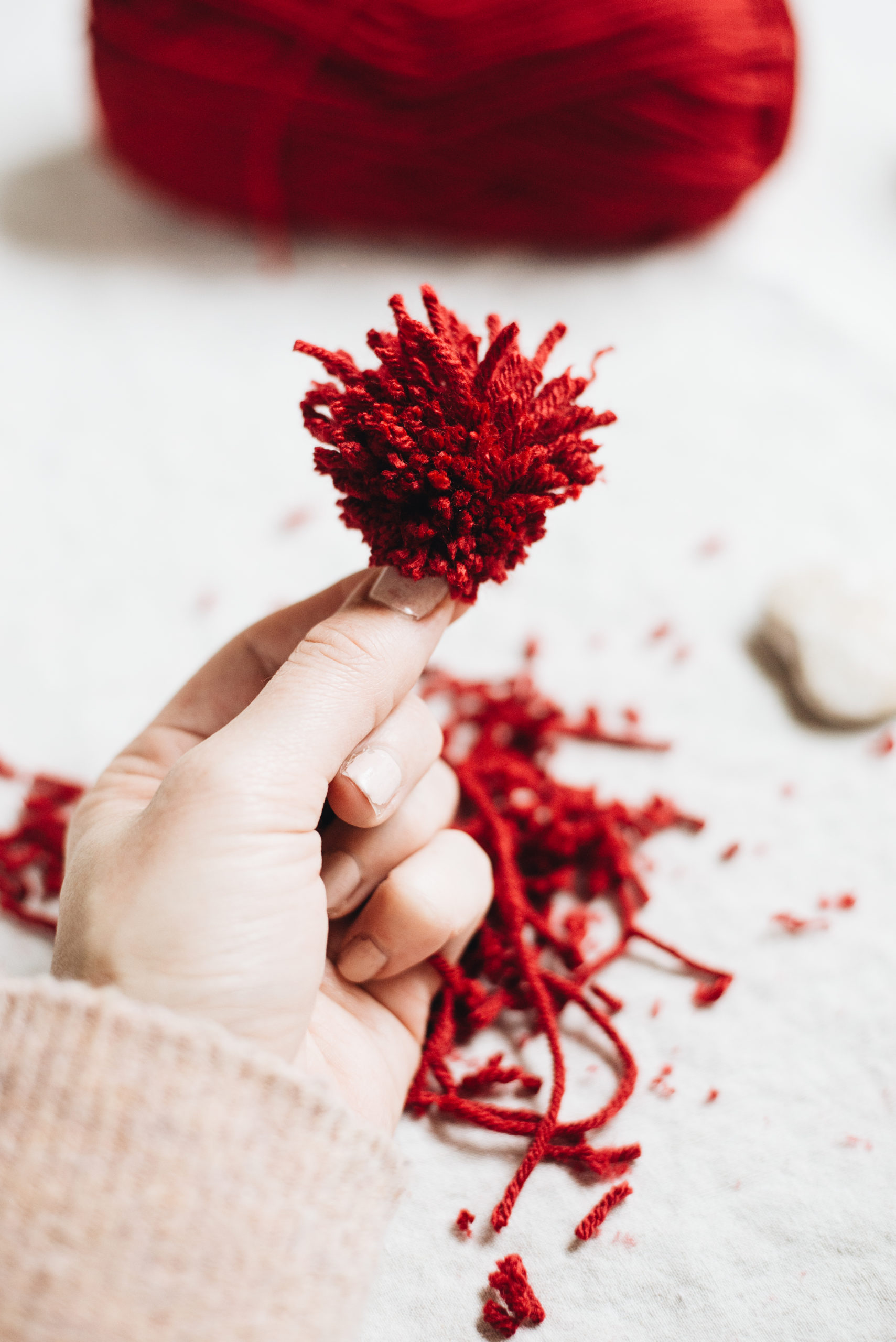 trim heart pom poms to desired length with scissors