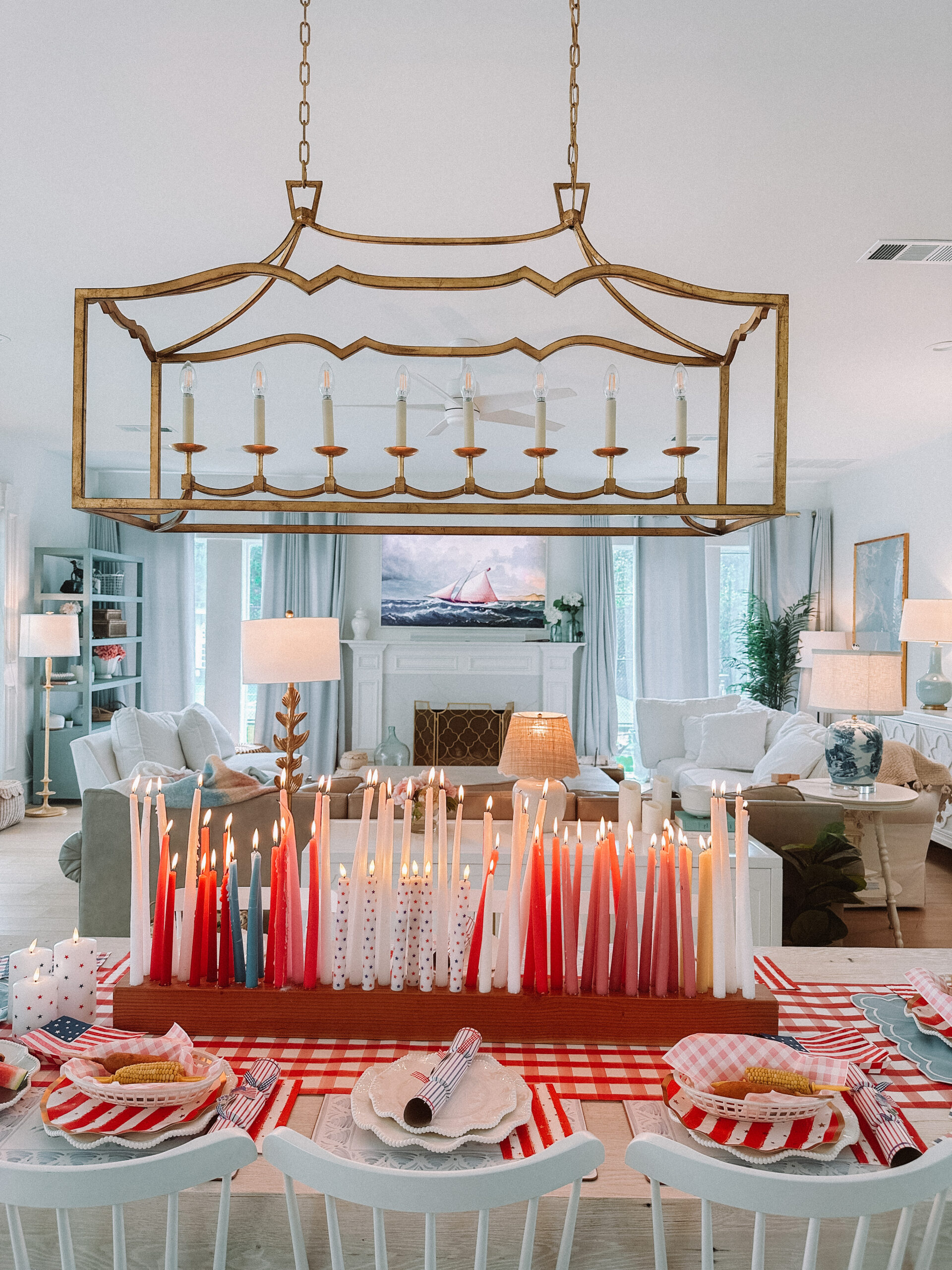 4th of July Table Setting Red Gingham Table Runner Flag Plates Scalloped Plates Wood Candle Holder Star Candles Set Stanley Cup in Pool Patriotic Dinner Table Family 4th of July Celebration 4th of July Backyard Party